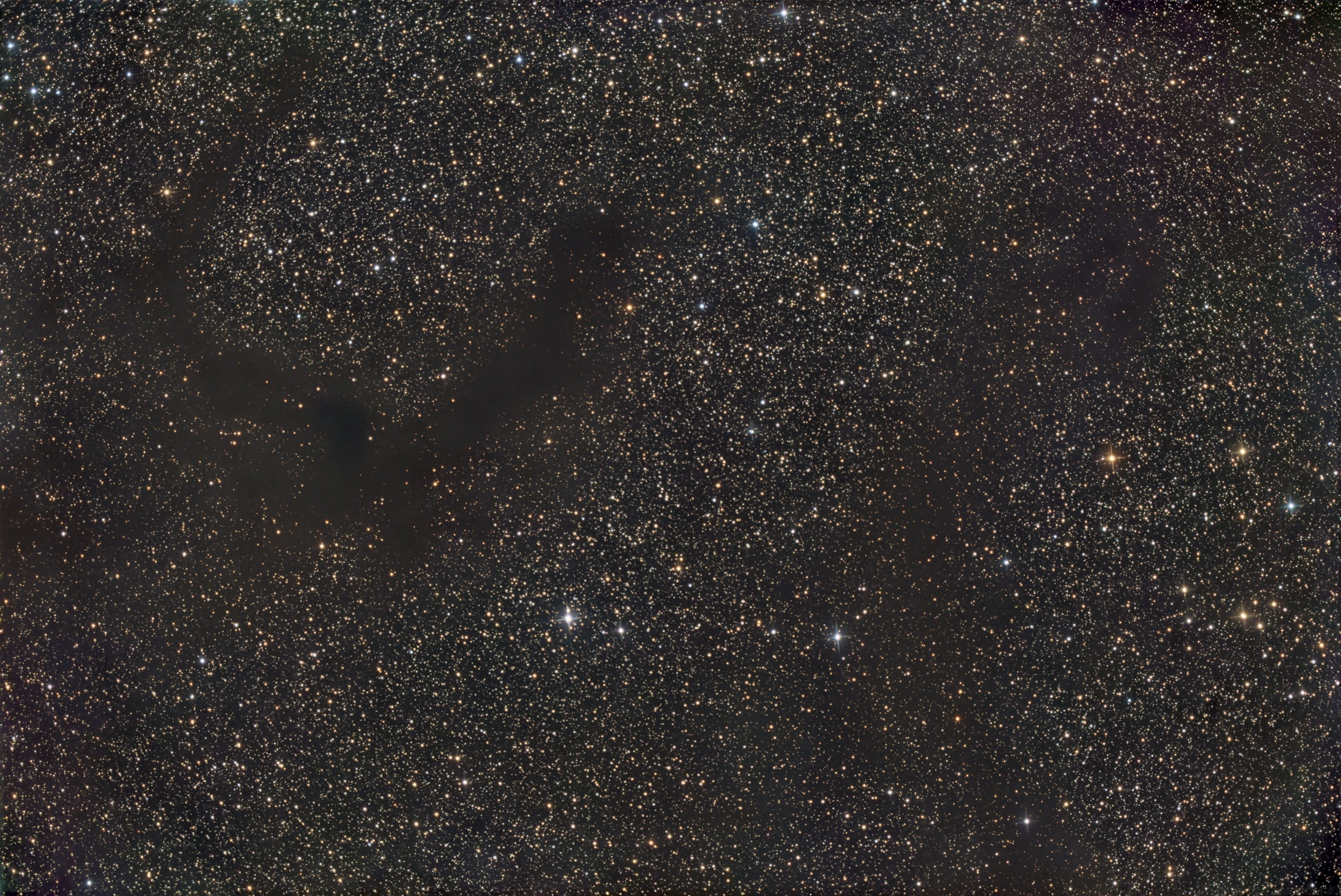 Barnard's Dark Nebula B142 and B143, also known as the E Nebula, are located in the constellation Eagle (Aquila) and in an area of ​​enormous abundance of stars.